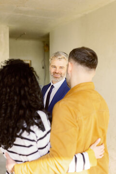 Buyers discuss rental options real estate agent 
