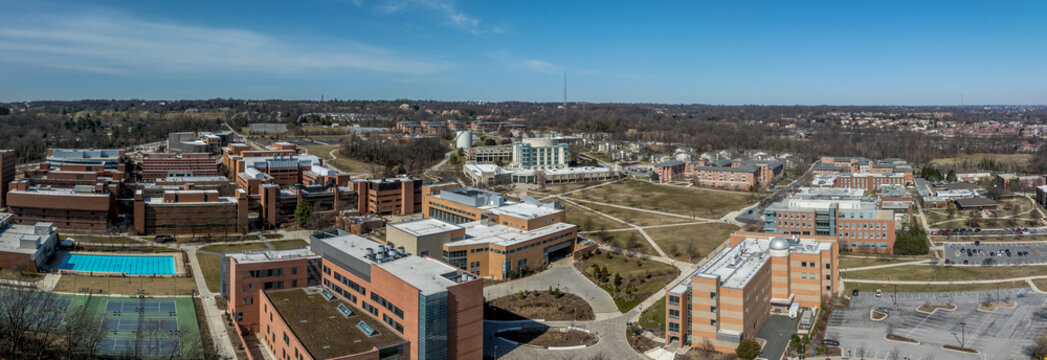Aerial view of University of Maryland Baltimore County UMBC Catonsville admission office, pool, commons, quad, Honors college, admission office, retriever activities center, kuhn plaza, erickson field