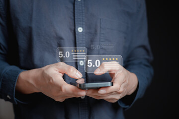 Customer service satisfaction survey concept.Business people or customers show satisfaction through the application on the tablet screen. By giving the most satisfaction rating and 5 stars.