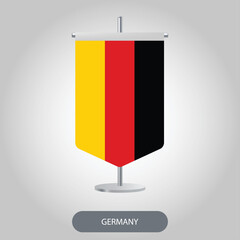 Germany vertical desk flag isolated on light grey background. Germany table flag on barely white background.