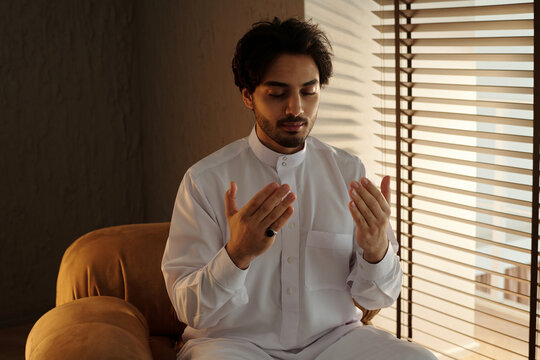 Young Middle Eastern Man Praying to Allah