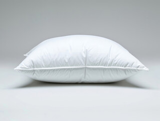 The white cotton pillow is set against a white background.