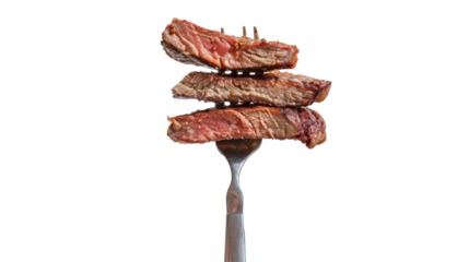 Pieces of perfectly cooked steak on a fork