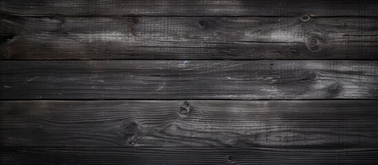 Obraz na płótnie Canvas A black and white picture showcasing the intricate details and textures of vintage weathered wood planks. The photo highlights the natural patterns and aged appearance of the wood.