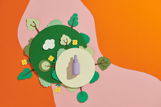 Beauty treatment product in scene with floral and leaves around