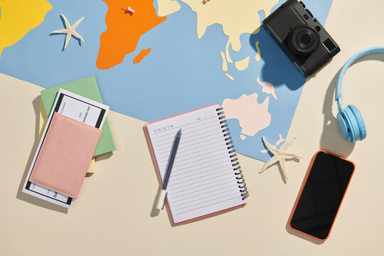 Flat lay composition with world map and different travel