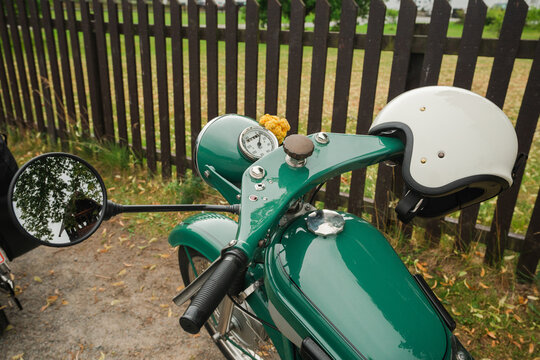 Close up of motorbike and helmet in countryside 
