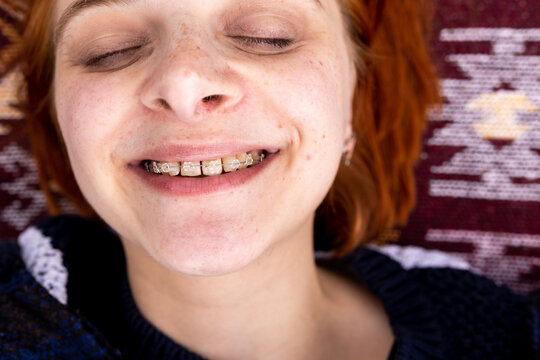 happy woman wearing teeth bracelets 