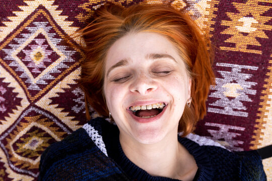 portrait of woman happy wearing teeth bracelets 