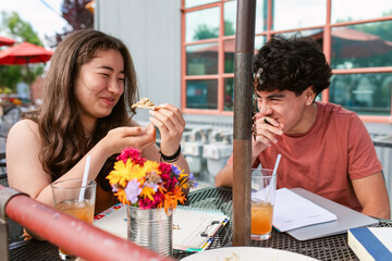 Smiling Teen group eating and studying  