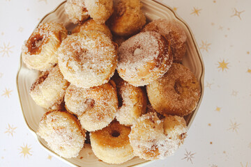 donuts with sugar in a bowl