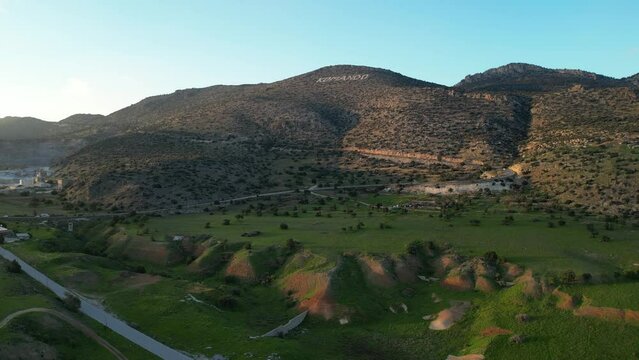 Landscape. The hills, mountains, meadows and plains of Cyprus. Komando. A road with cars. Quarry.