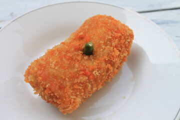 Indonesian snack called risoles in a white plate on the table