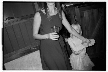 Mother and daughter dancing direct flash portrait