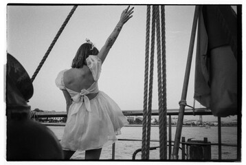 Anonymous woman in dress celebrating with crown