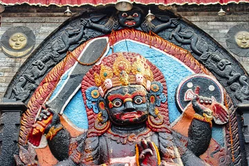 Foto auf Leinwand Kaal Bhairav - An open air temple with a powerful manifestation of the Hindu god Shiva built in black stone by King Pratap Malla  at the center of the historic Durbar square in Kathmandu,Nepal © InnerPeace