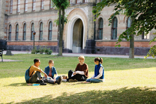 Faculty classmate education seeker friend meeting uni campus interact