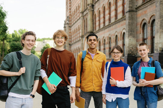 Groupmates undergraduate optimism campus academia setting eye contact