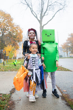 Kids out trick or treating on Halloween