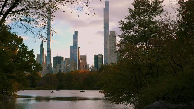 Manhattan New York City skyline seen from Central Park with boats in autumn