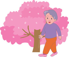 桜と散歩をする高齢女性

