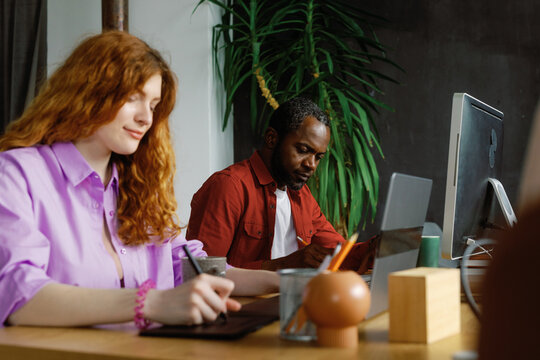 Coworker tech use creative development industry workplace concentrated