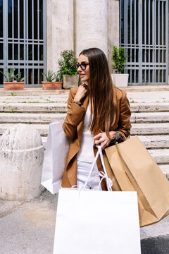 Woman with shopping bags in the city
