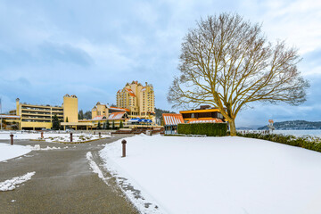 Fototapeta na wymiar The resort downtown district along the lake in the North Idaho Panhandle city of Coeur d'Alene, Idaho USA, with snow on the ground at winter.