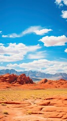 Fototapeta na wymiar Panoramic landscape view of beautiful red rock canyon formations during a vibrant sunny day