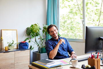 Content male accountant smiling during remote work