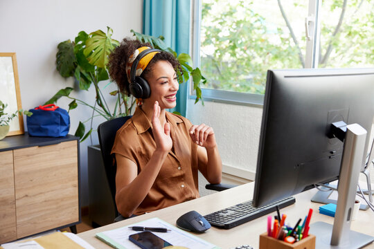 Freelancer having video call via computer at desk