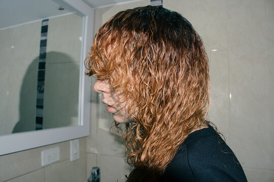 Woman cutting her hair