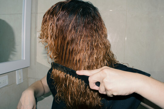 Woman cutting her hair