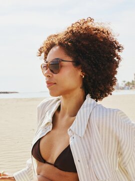 Stylish woman portrait on the beach 