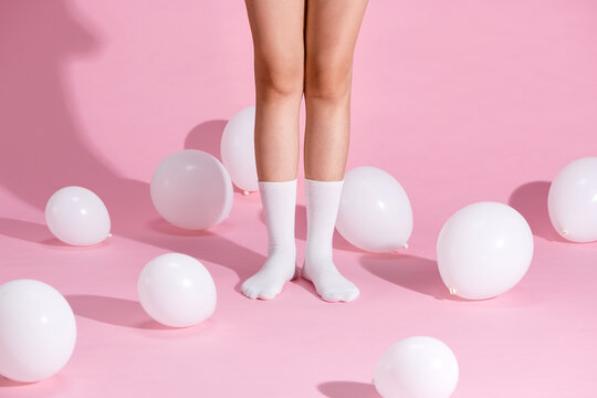 Vertical side view female legs in a gray tights and retro