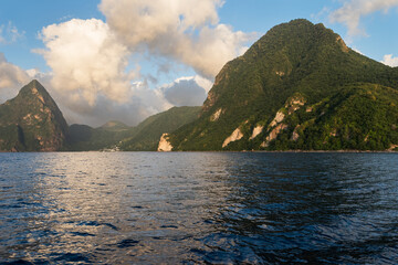 The Piton Peaks are two volcanic lava domes that rise above the Caribbean Sea in dramatic fashion....