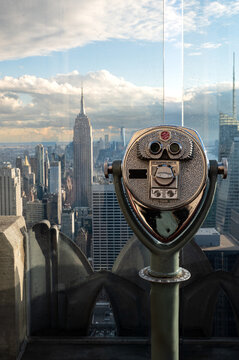 Binoculars on observation platform with empire state building view
