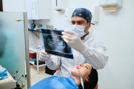 Dentist reviewing an x-ray of the patient