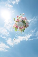 Bouquet of flowers tossed into the air under blue sky.  Event celebration photography. - 751138175