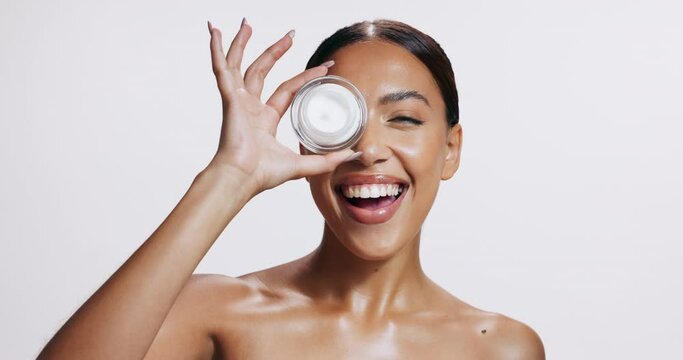 Woman, cream and smile for skincare, anti aging and hydration mask in studio on white background. Female person, flawless skin or glow for application of spf dermatology product for sun protection