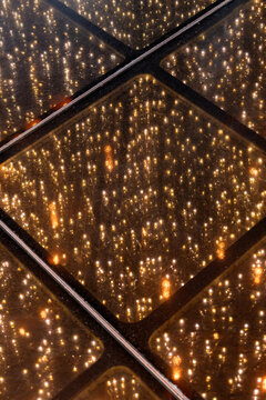 Closeup of a party floor illuminated with golden lights