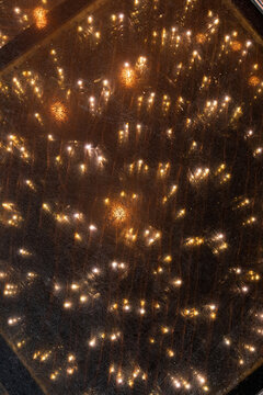 Closeup of a floor illuminated with bright golden lights