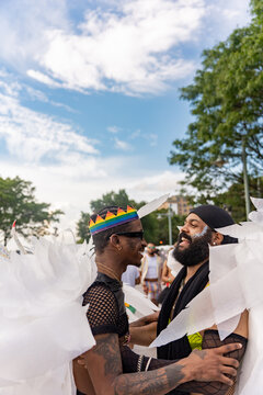 Portrait Of Gay Couple During Pride March Parade In New York.