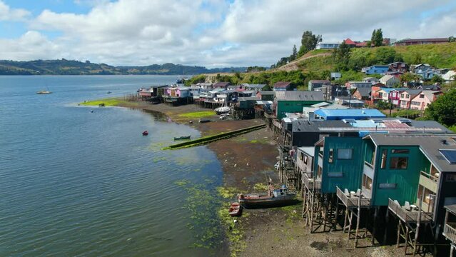 Aerial Panoramic Sea Coast Drone above Castro stilt houses Chilean Patagonia Sky Islet Landscape in Summer Daylight, South American Chilo&eacute; Travel