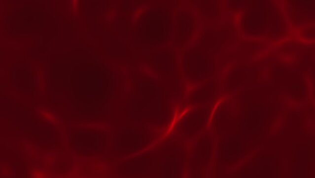 Animation of red gentle defocused caustics as seen on water surface