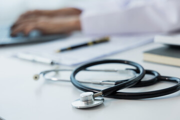 Female doctor works with her laptop computer in the doctor's office.