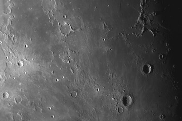 Photo of the lunar surface through an amateur telescope. Craters Era Mauro, Parri, Reinhold, Lansberg, Montes Riphaeus, Mare Cognitum.