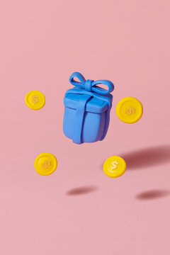 gold coins are floating around a Gift box