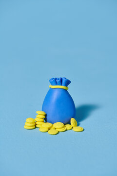 bag of coins isolated on a blue background