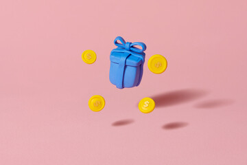 gift box with flying gold coins and gift box